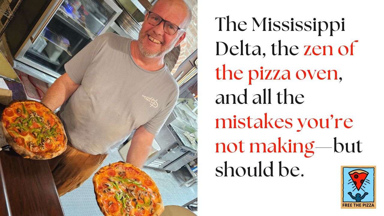 Dutch of Tribecca Allie's Cafe holding two pizzas